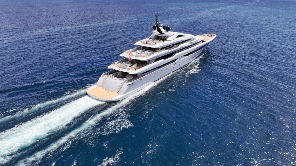 Aerial,Drone,Tracking,Photo,Of,Super,Yacht,With,Wooden,Deck