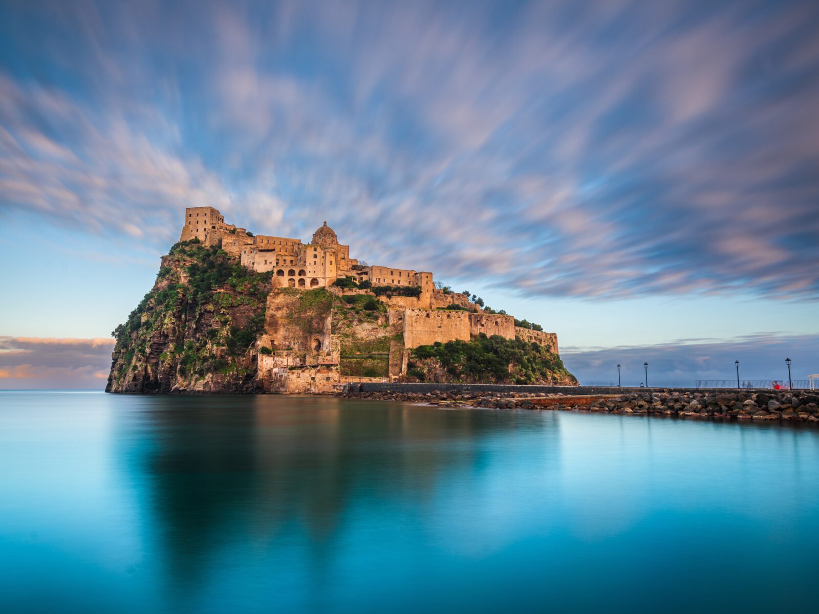 Ischia,,Italy,With,Aragonese,Castle,In,The,Mediterranean,At,Dusk.
