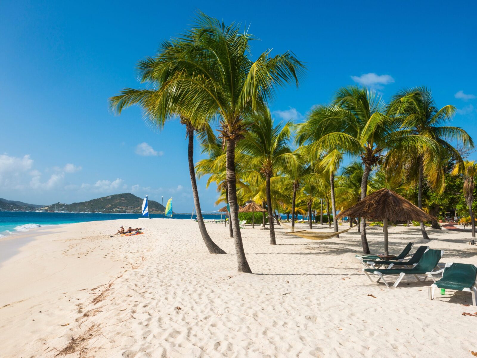 Palm,Fringed,White,Sand,Beach,On,Palm,Island,With,Union