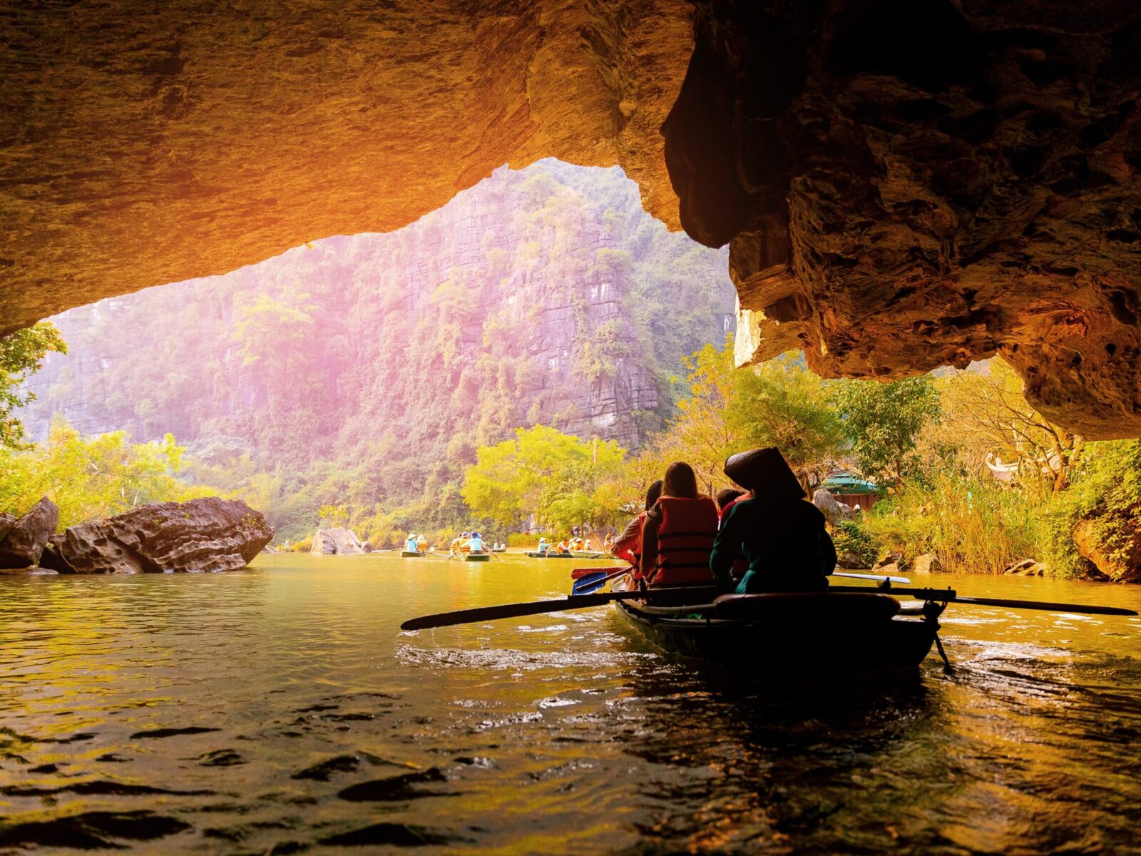 Scenic,Boat,Ride,Through,Ninh,Binh,Caves,And,Limestone,Mountains,