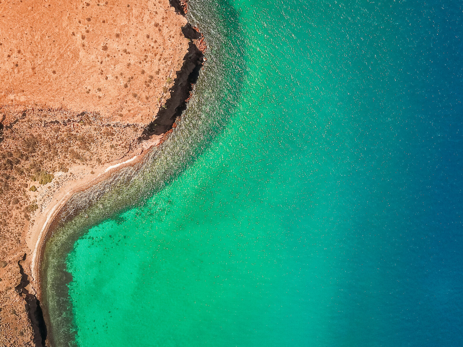 An,Aerial,Shot,Of,Blue-green,Waters,In,Isla,Del,Espiritu