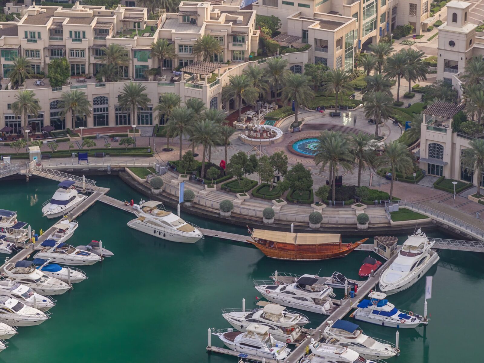 Aerial,View,On,Yachts,Floating,In,Dubai,Marina,Timelapse.,White